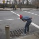 CSI checking for sounds of imprisoned Vechtes Brook through sewer grate at 2nd St and PPW.